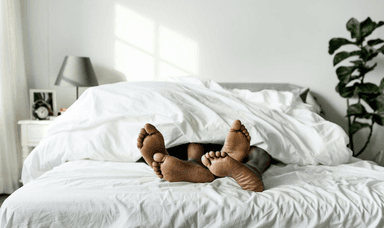 Couple's feet under duvet – Inclusive health support and discounted sexual wellness solutions for disabled people.