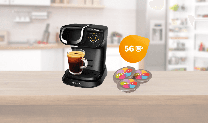 Tassimo My Way coffee machines black on a kitchen counter, each brewing coffee into glass cups, with a bundle of 56 Tassimo pods displayed alongside, showcasing kitchen appliance savings and accessible coffee bundle deals for disabled people.