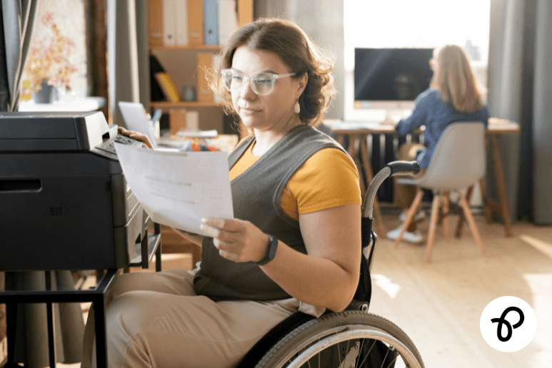 Disabled person working at home in a wheelchair representing the UK Right to Try rule and support for people with long term health conditions returning to work.